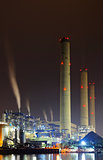 power station at night with smoke