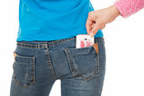 Sexy woman with a cell phone in her back pocket