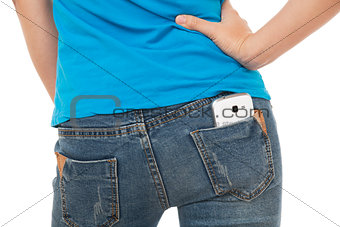 Sexy woman with a cell phone in her back pocket