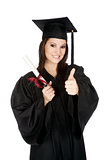 Beautiful Caucasian woman posing in a black graduation gown