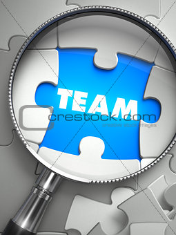 Team - Missing Puzzle Piece through Magnifier.