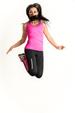 Young fitness woman jumping high