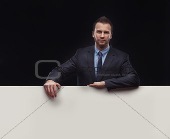 businessman standing on dark background