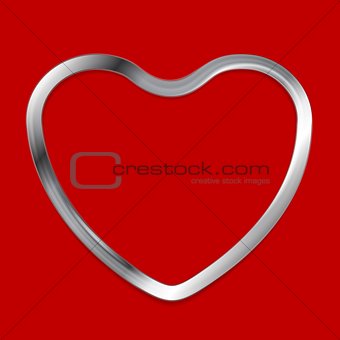 Metal heart on red background