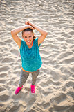 Portrait of fitness young woman on beach