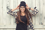 Hipster girl in glasses and black beanie