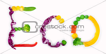 eco inscription from pieces of vegetables on white background