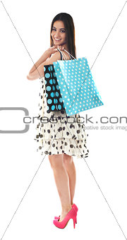 Stunning teenager carrying shopping bags