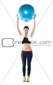 Gorgeous fit lady holding pilate ball