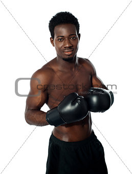 Muscular african boxer posing in style