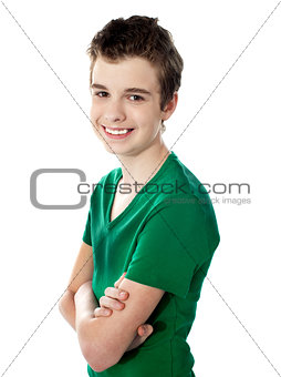 Young boy posing with folded arms