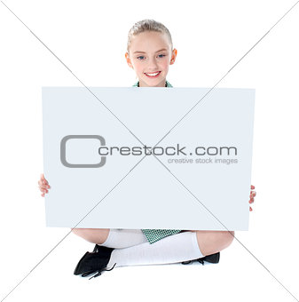 School girl showing blank billboard