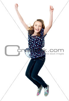 Young girl jumping in excitement