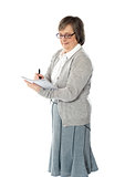 Senior woman writing in spiral notebook