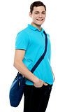 Teenage guy carrying laptop bag