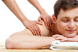 Attractive young man getting spa massage