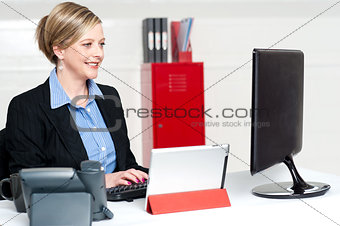 Confident businesswoman working in office