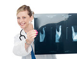 Female surgeon holding x-ray report