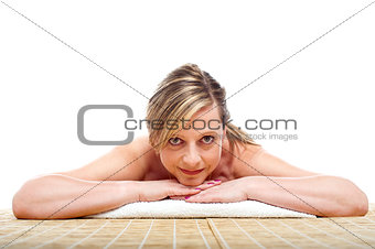 Matured naked woman lying on mattress