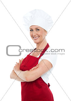 Happy middle aged woman with crossed hands