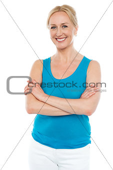 Beautiful woman standing with arms crossed