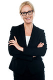 Businesswoman with crossed arms wearing glasses
