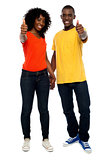 Happy african couple showing thumbs up