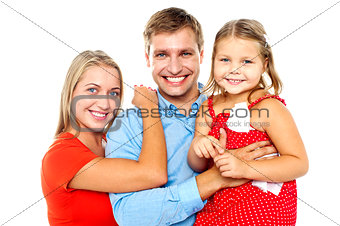 Cheerful family of three facing camera and smiling