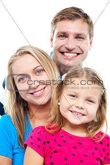 Husband posing with his adorable wife and daughter