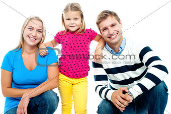 Gorgeous couple posing with beautiful girl child