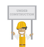 Worker with under construction sign