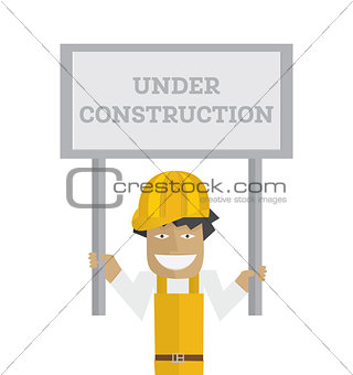 Worker with under construction sign