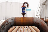 blue valve on rusty piping