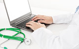 Doctor using laptop close up