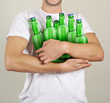 Consumer with a lot of bottles of beer in their hands