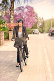 Businesswoman Biking at the Street with Helmet