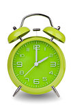 Green alarm clock with hands at 2 am or pm