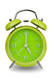 Green alarm clock with hands at 5 am or pm