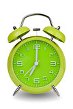 Green alarm clock with hands at 7 am or pm