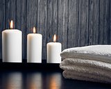 Spa massage border background with towel stacked and candles