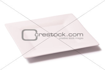 White empty rectangular plate of porcelain on a white background