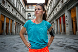 Portrait of fitness woman near uffizi gallery in florence, italy