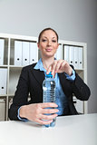 Businesswoman with water bottle