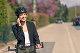 Businesswoman riding to work pausing for a call