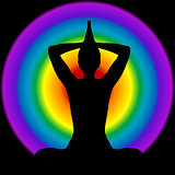 Human silhouette in yoga pose with aura and chakras colors on ba