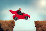senior superhero driving a car off a ravine 