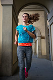 Fitness woman jogging outdoors in the city