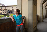 Fitness woman standing not far from ponte vecchio in florence, i