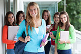 Smiling teenagers with exercise books
