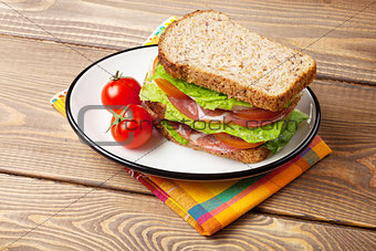 Sandwich with salad, ham, cheese and tomatoes